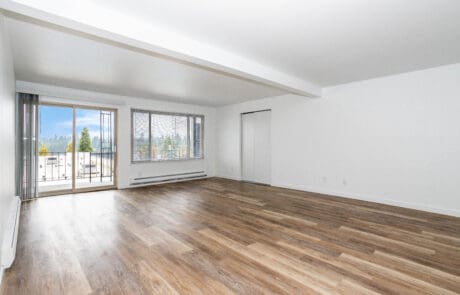 Apartments in Shoreline for Rent - Octavia - Living Room with Wood-Style Flooring and an Attached Private Patio